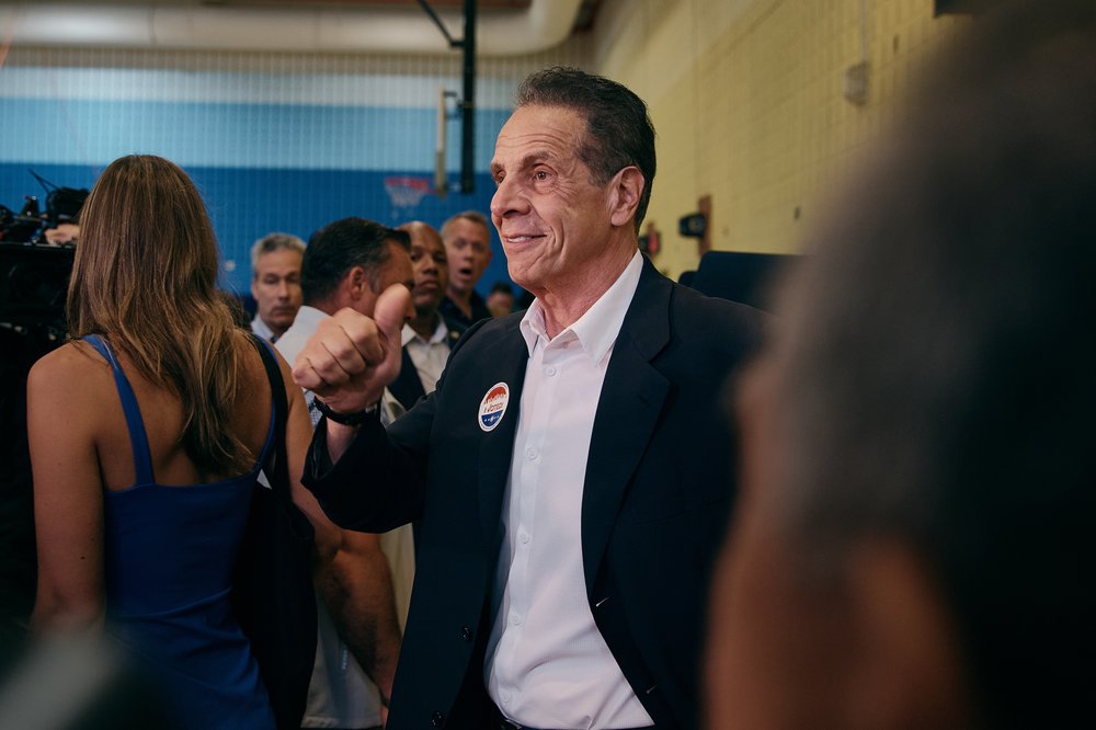 Andrew Cuomo gives a thumbs up at a poll site.