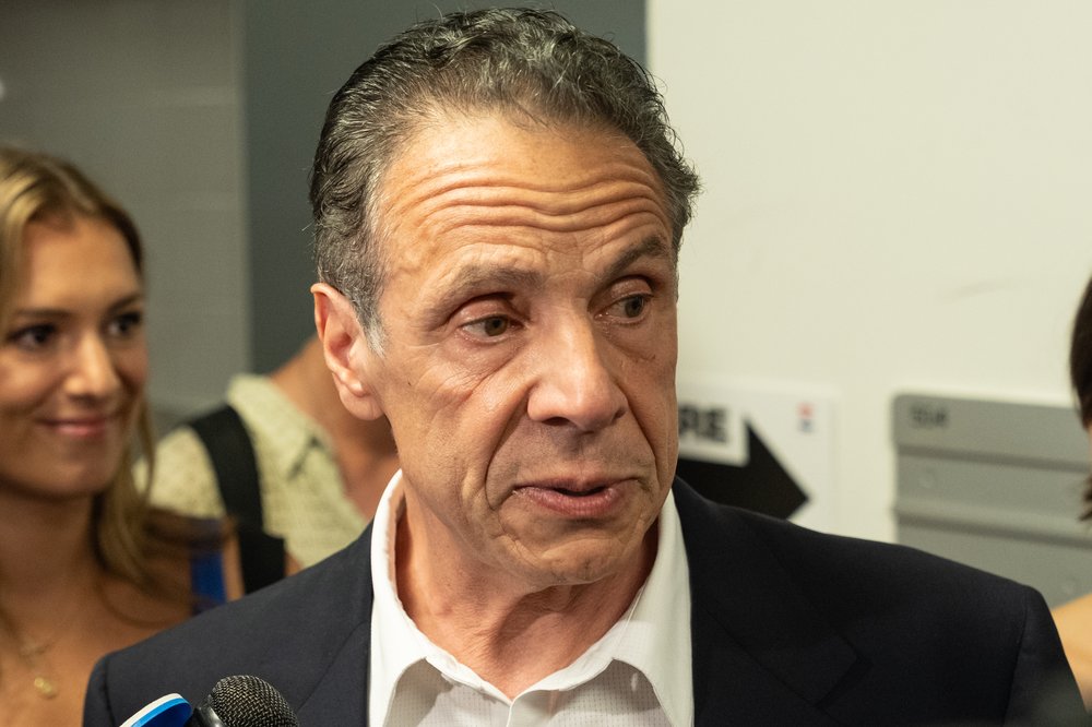 Former Gov. Andrew Cuomo speaks to reporters before casting his vote in the June 2025 Democratic primary election.