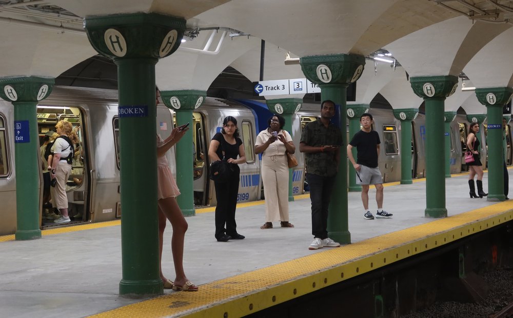 Riders waiting for a PATH train on the platform at Hoboken.