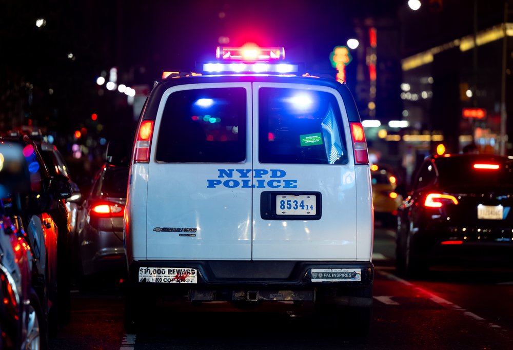 An NYPD vehicle with its emergency lights activated