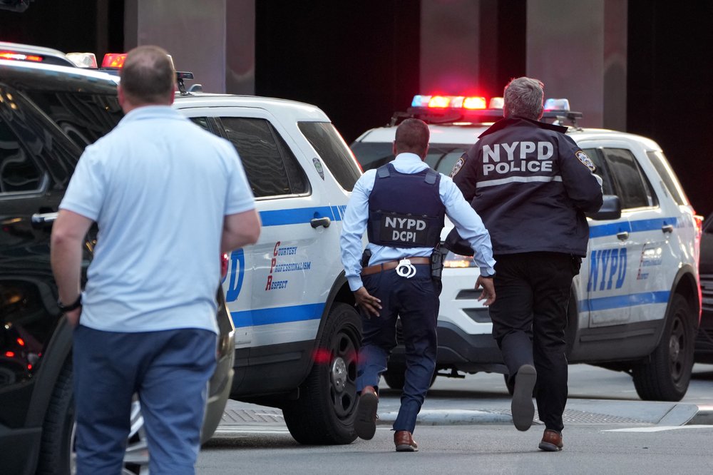 NYPD officers are seen as they respond to an incident in the Midtown Manhattan neighborhood of New York on July 28, 2025.