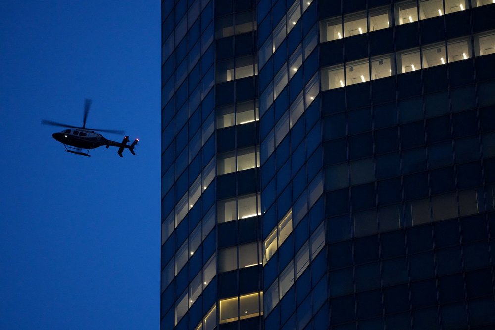 An NYPD helicopter flies overhead as police respond to a shooting incident in the Midtown Manhattan neighborhood of New York on July 28, 2025.