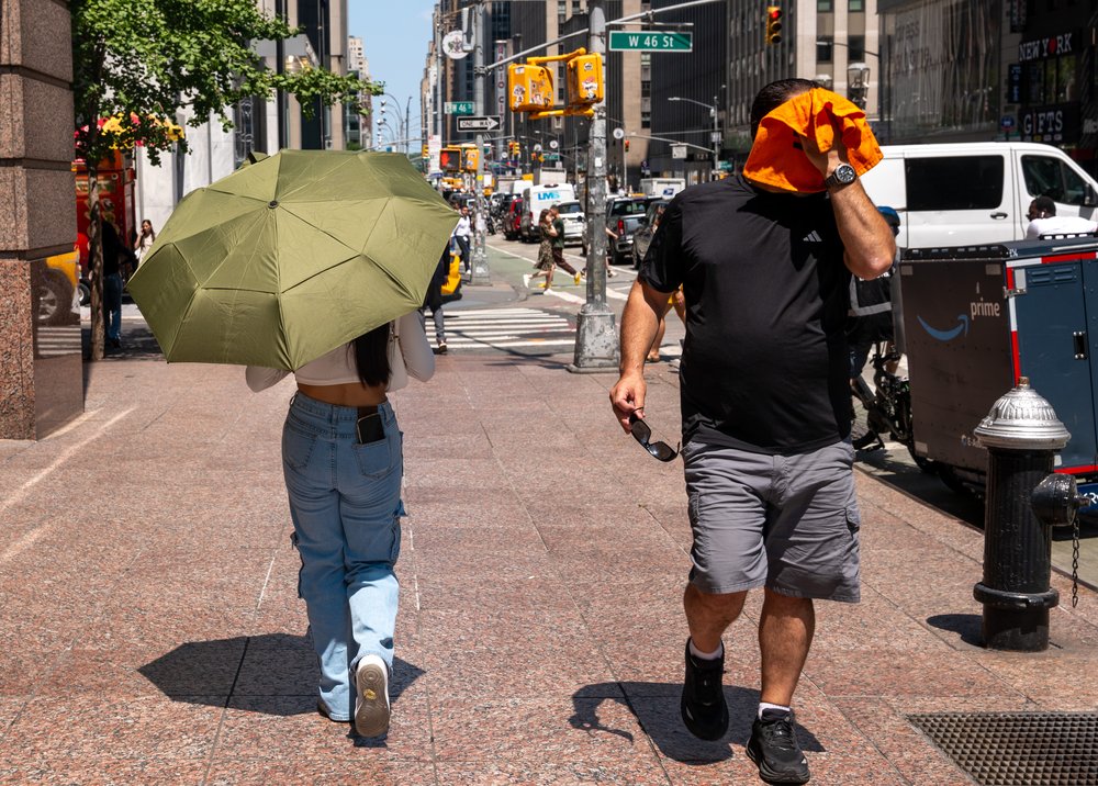 People try to stay cool on the sweltering streets of Manhattan as the region experiences another heatwave on July 29, 2025 in New York City.