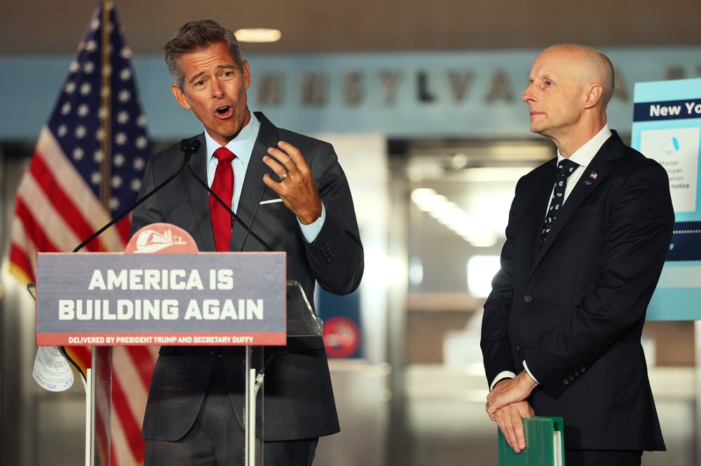 Two men who are trying to renovate Penn Station.