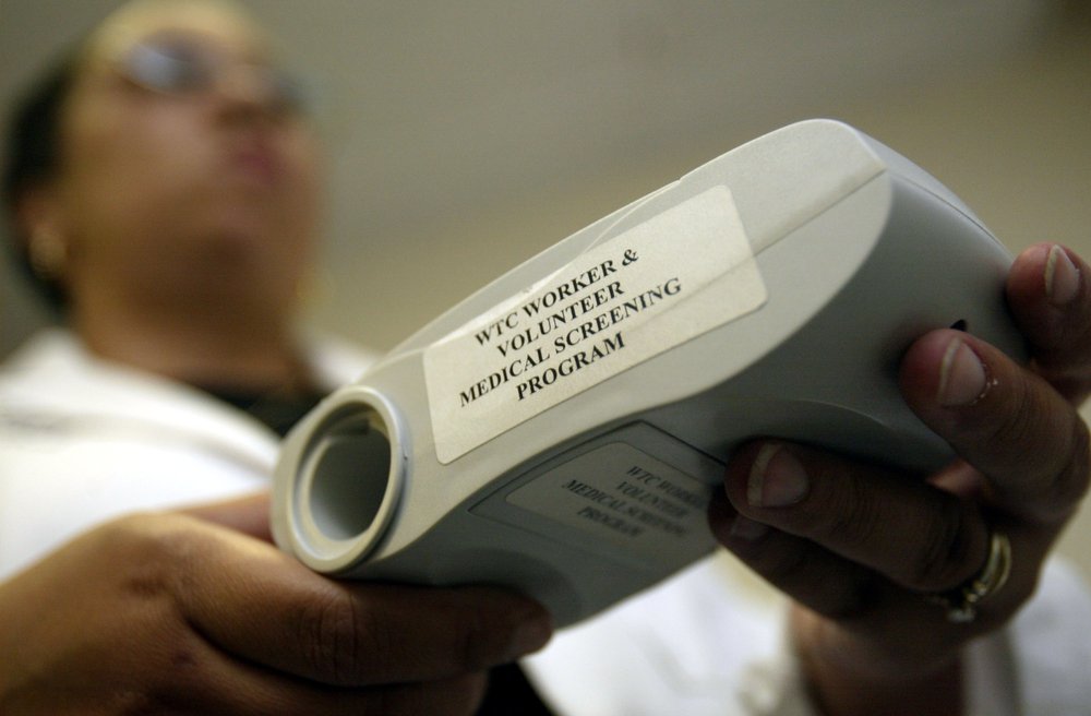 Health caregiver holds a medical device