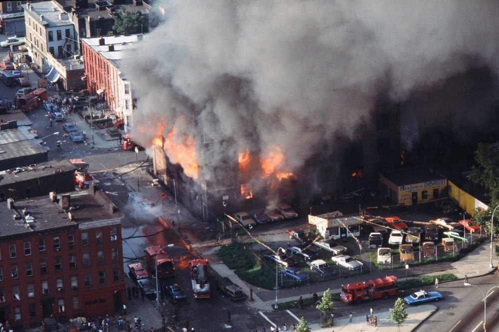 An aerial view of a building burning in the wake of the New York City blackout, Brooklyn, New York, New York, July 14, 1977.