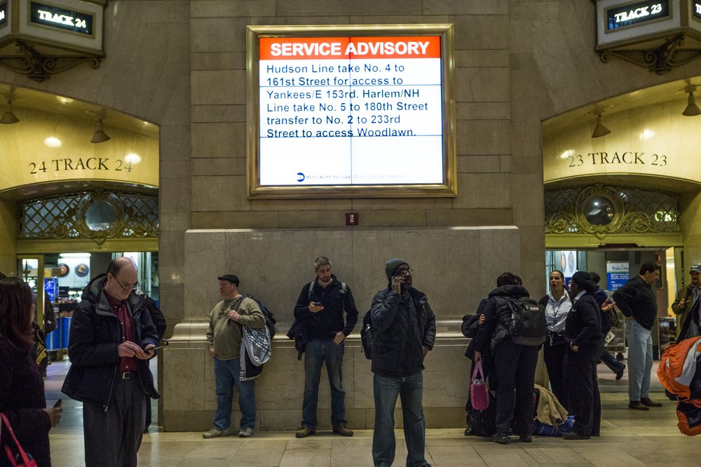 Commuters wait at Grand Central Terminal after Metro-North service was disrupted by a building collapse in East Harlem on March 12, 2014.