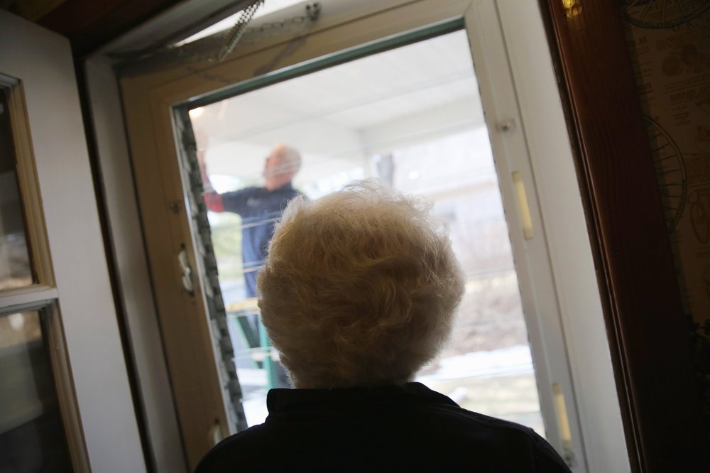 Photo of a woman at a door