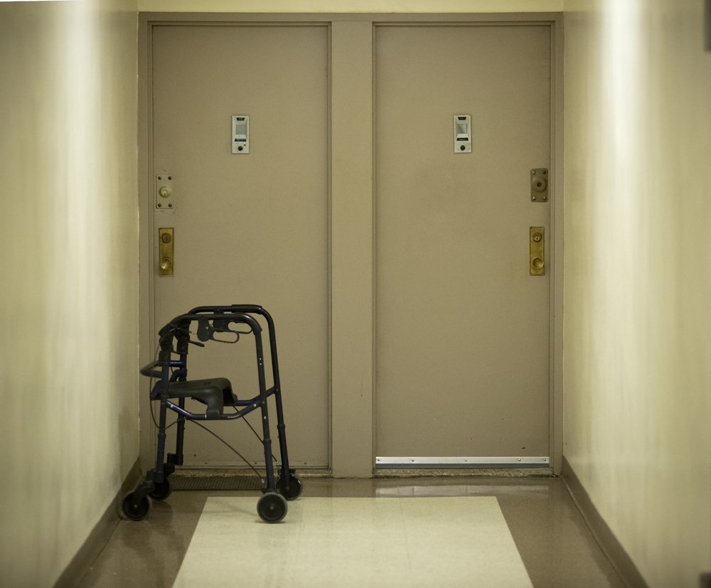 Photo of a walker outside an apartment door