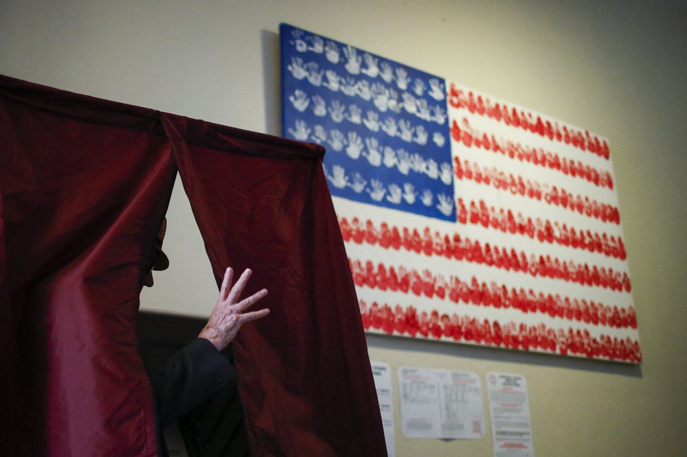 A man casts his ballot at polling station during New Jersey's primary election in 2016.