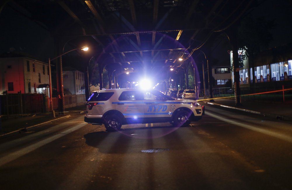 A NYPD car at a crime scene in Ozone Park.