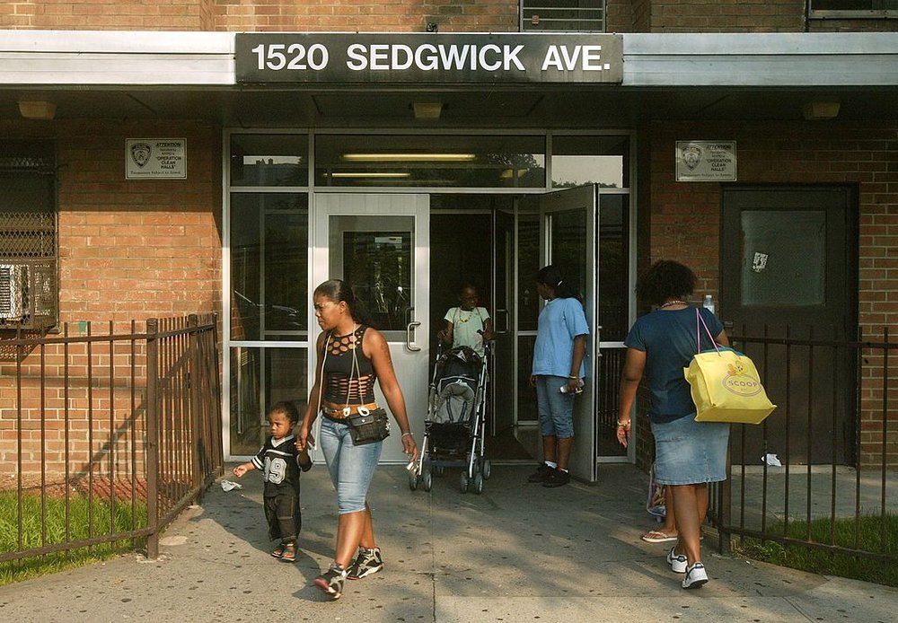 Outside of the 1520 Sedgwick Ave, the Bronx building known as the birthplace of hip-hop, as residents walk in and out.