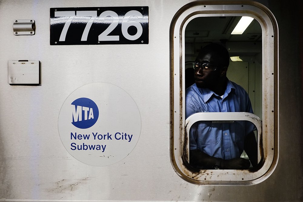 A subway conductor on the job.