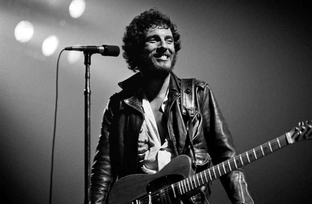 Bruce Springsteen performing on stage for the "Born to Run" tour in 1975.