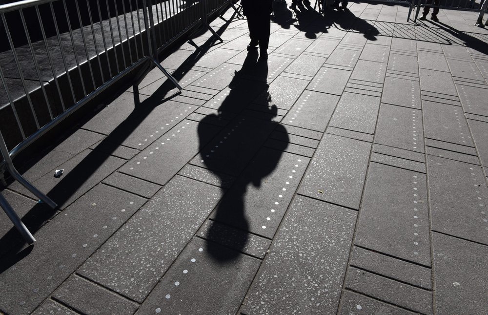 The shadow of a NYPD officer during a press conference in Times Square on January 2, 2018.