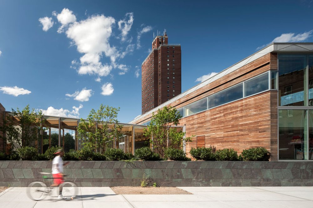 The Weeksville Heritage Center in Crown Heights, a modern angular building with wood paneling.