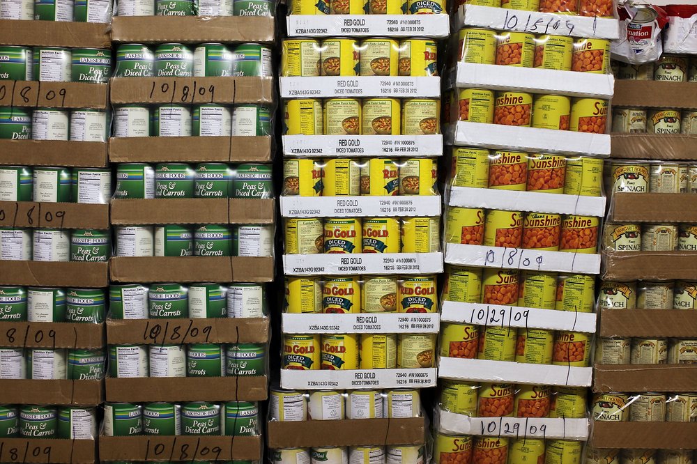 Pallets of canned goods are stacked inside the food pantry at St. Augustine's Church on November 23, 2009 in the Bronx borough of New York City.