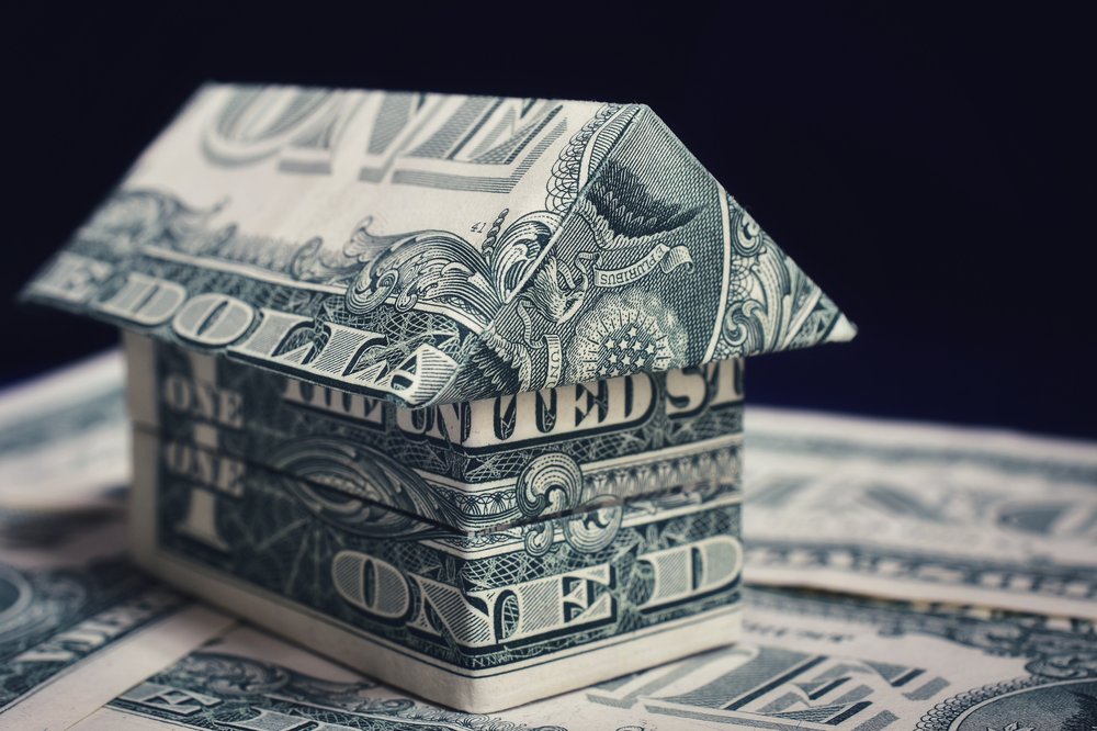 An illustration of a house made out of dollar bills