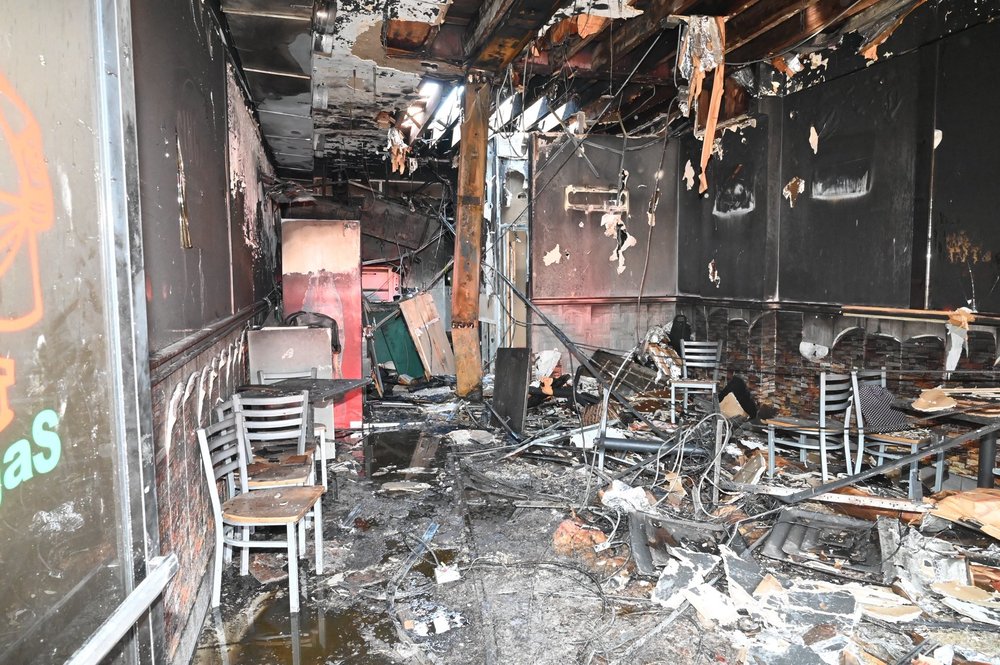 The scorched interior of Singas Pizza in Flushing, Queens, following a two-alarm fire caused by a lithium-ion battery.