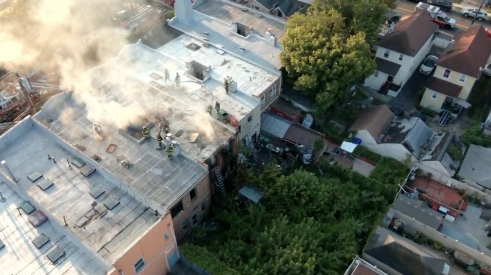 FDNY crews work to extinguish a four-alarm fire on Sutphin Boulevard in Queens.