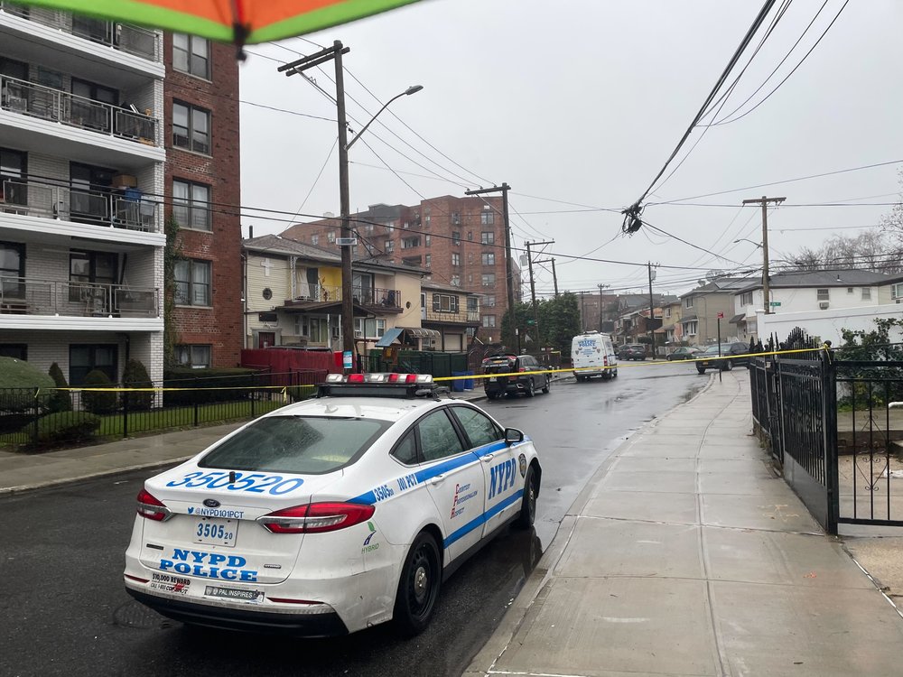 A police cruiser and police tape on Beach 22nd St.