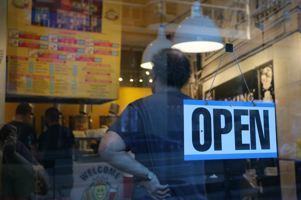 An "open" sign sits in the front window of the new Papaya King location on the Upper East Side.