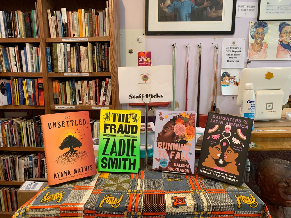 A table with four books displayed