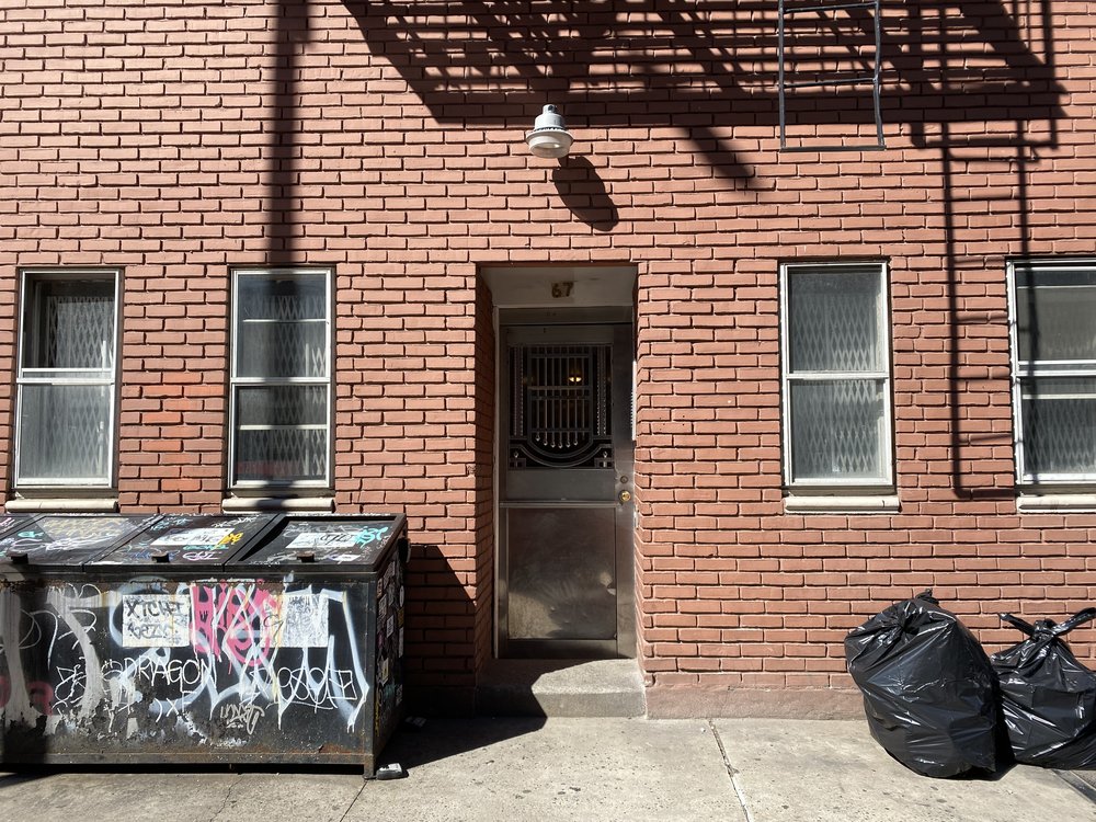 A brick building on the Lower East Side where 11 residents now face eviction.