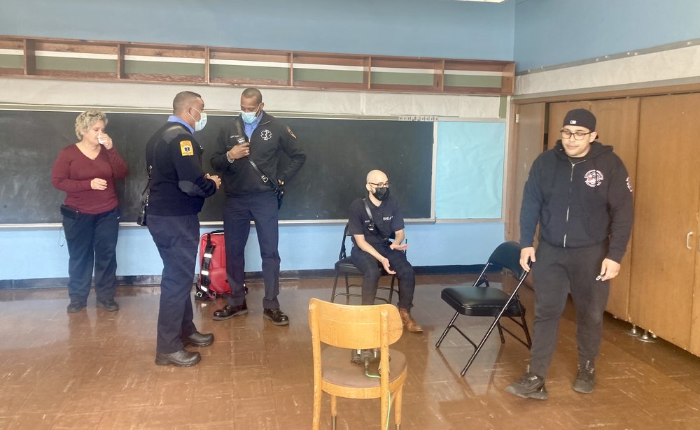 B-HEARD team members in Brooklyn act out a scenario in which they're called to a dispute. The New Jersey version of the program is different; a police officer and mental health professional are dispatched to certain mental health calls.