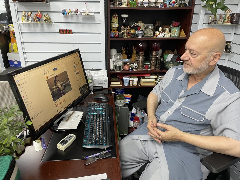 Zein Rimawi, 71, sits at his desk at the An-Noor Social Center in Bay Ridge on Aug. 1, 2025.