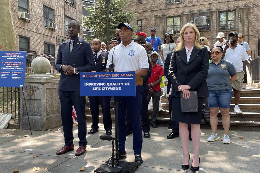 Mayor Eric Adams, at center, joins NYPD commissioner Jessica Tisch and Councilmember Yusef Salaam at NYCHA’s Walt Whitman Houses on Monday.