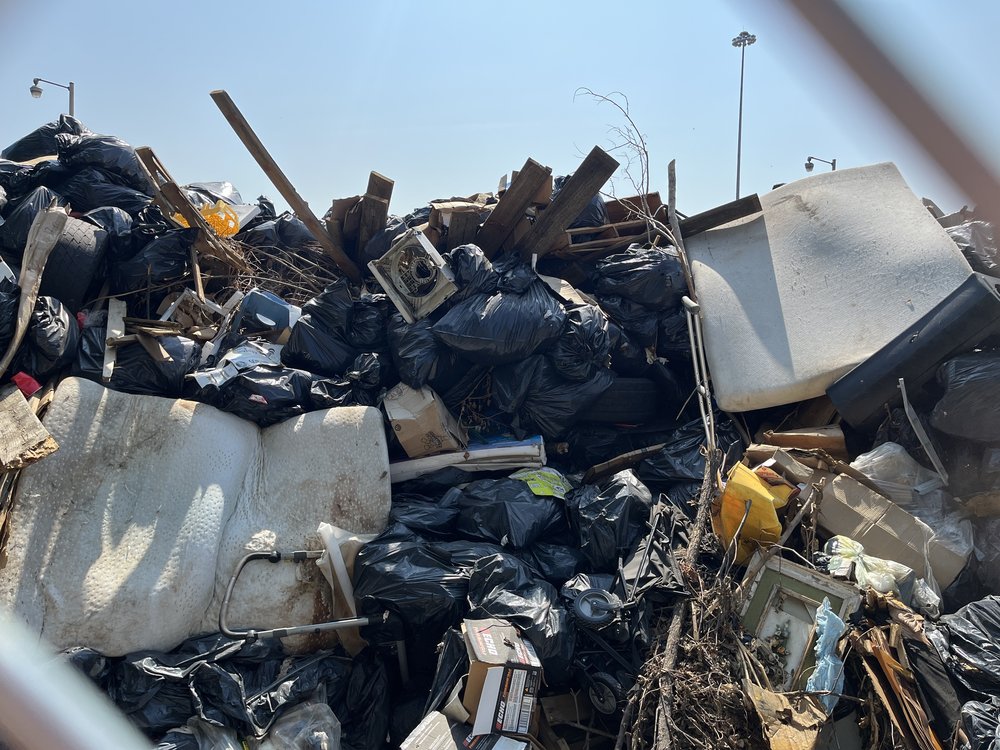 The parks department has turned a parking lot at its Bronx headquarters into an unofficial garbage dump.