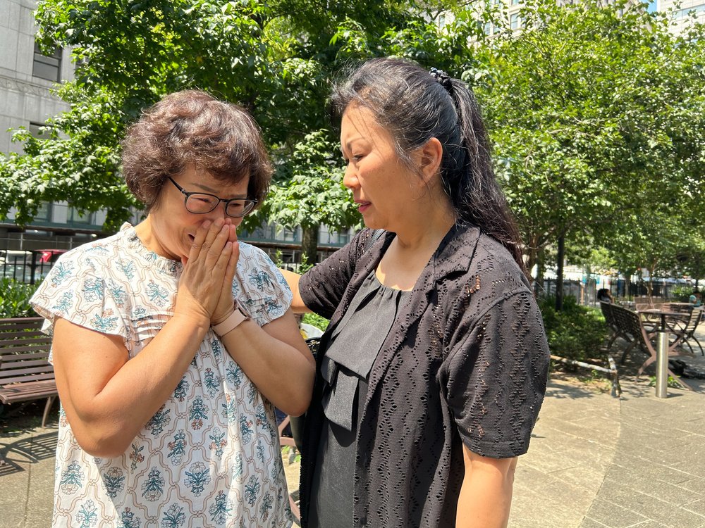 Boksun Lee, left, Christina Yuna Lee’s aunt, cries outside of court after the sentencing of the man who killed her niece.