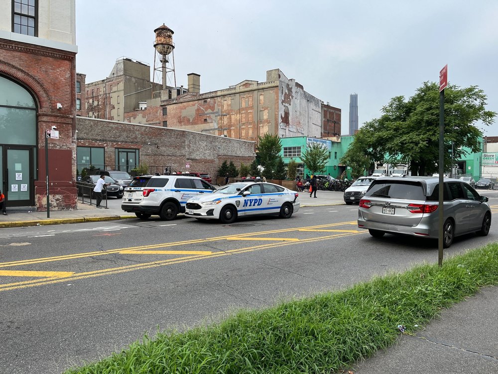New York City police cars in front of a building