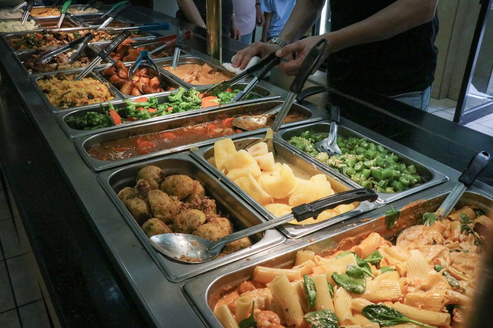 A buffet style arrangement of food.