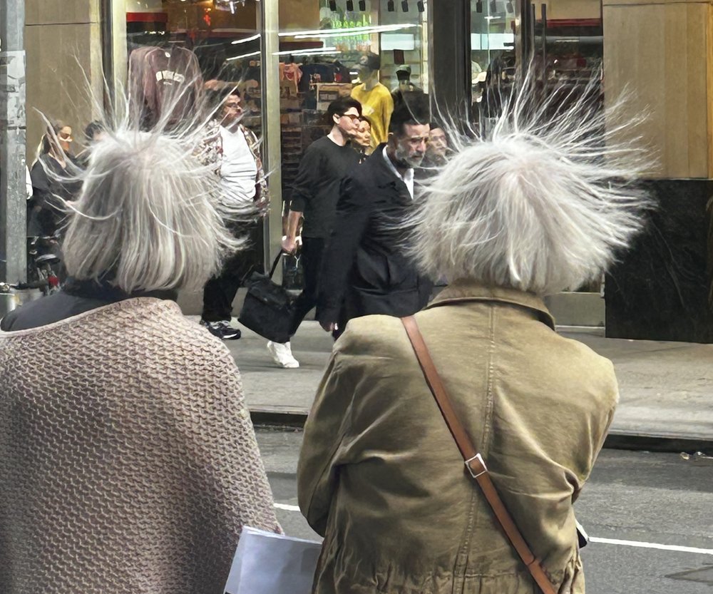 Niles Sams shot this photo of two people's hair sticking up at 7th Avenue and 41st Street.