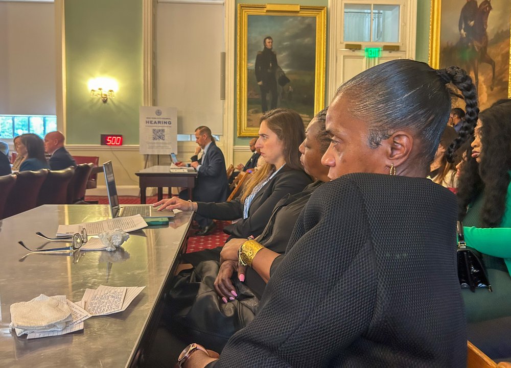 Tasha Carter Beasley, who says she was sexually abused while incarcerated on Rikers Island, listens to testimony at a City Council oversight hearing Thursday.