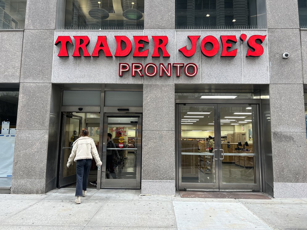 A new sign reads "Trader Joe's Pronto" in place of the former wine shop.