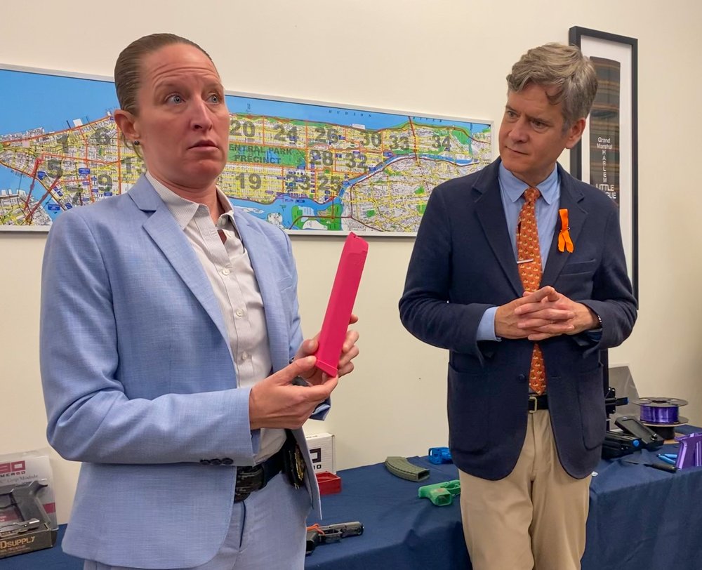NYPD Inspector Courtney Nilan, left, holds a 3D-printed gun part during a demonstration with Sen. Brad Hoylman-Sigal at the Manhattan District Attorney’s Office Friday.