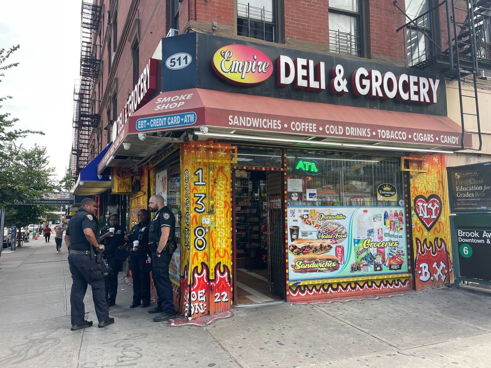 A photo of police at the bodega on the corner of East 138th Street and Brook Avenue in Mott Haven, where 71-year-old Enriqueta Rivera was shot and killed Thursday afternoon.