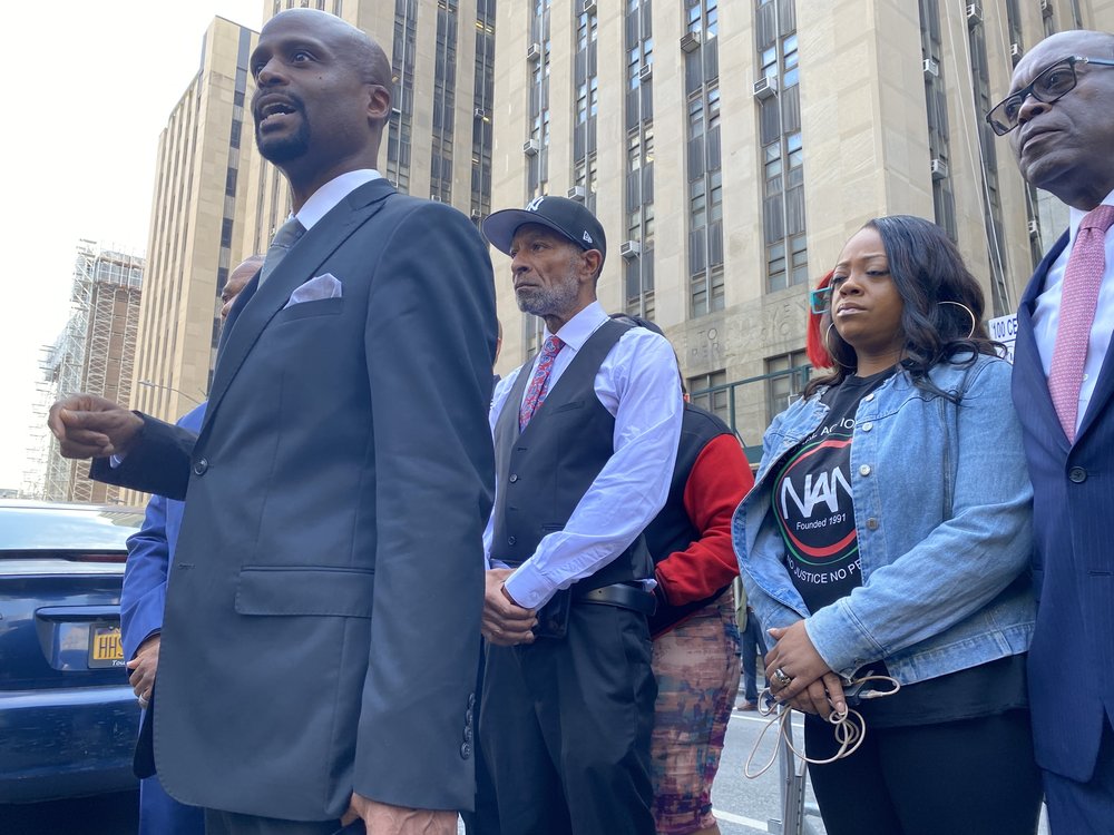 Jordan Neely’s father, Andre Zachery, center, appears with attorneys and supporters outside the courthouse Wednesday.