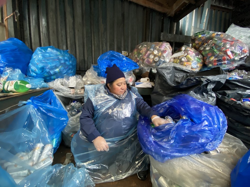 Canner Josefa Marin, 54, sorts through her two day haul, separating cans according to distributor. Marin has been a canner for more than 20 years.