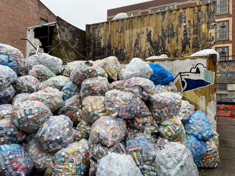 Bags of sorted cans ready for pickup by distributors or third-party contractors at a redemption center in Williamsburg on March 5, 2024.