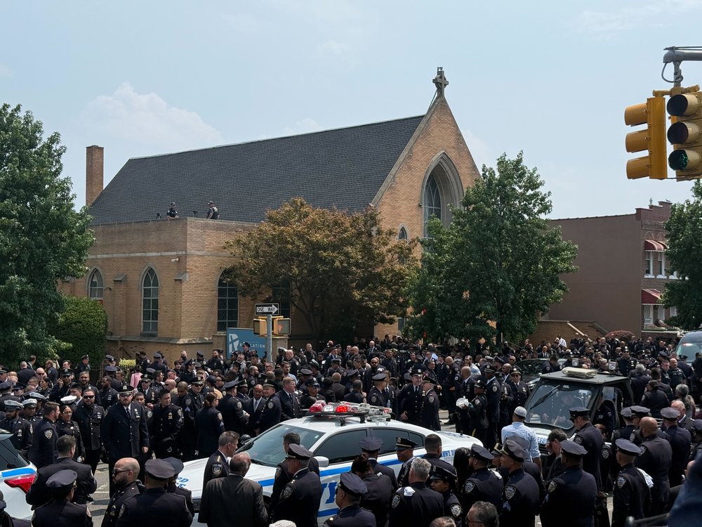 Uniformed police gather outside the funeral for slain NYPD officer Didarul Islam