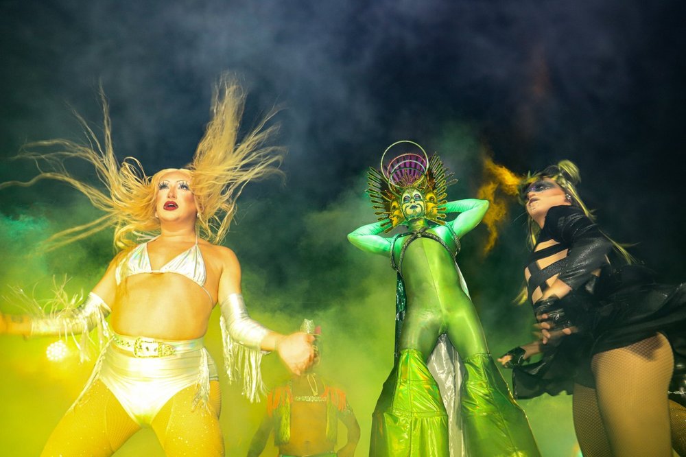 People celebrate in colorful costume at the Fire Island Pines Party