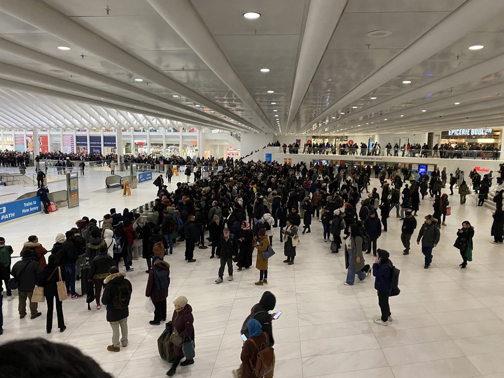 Crowds form as PATH train service is halted on Thursday evening.