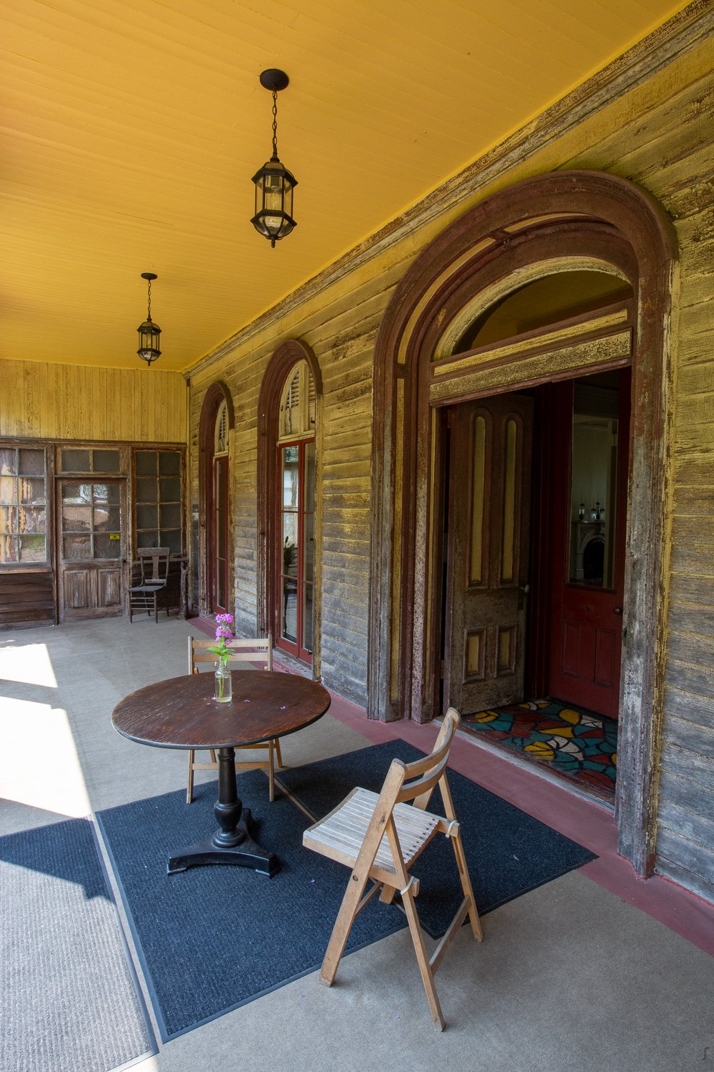 The front porch stretches the width of the building.