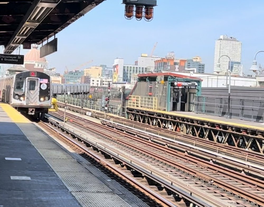 A J train approaches the Marcy Av. station in Williamsburg, Brooklyn.