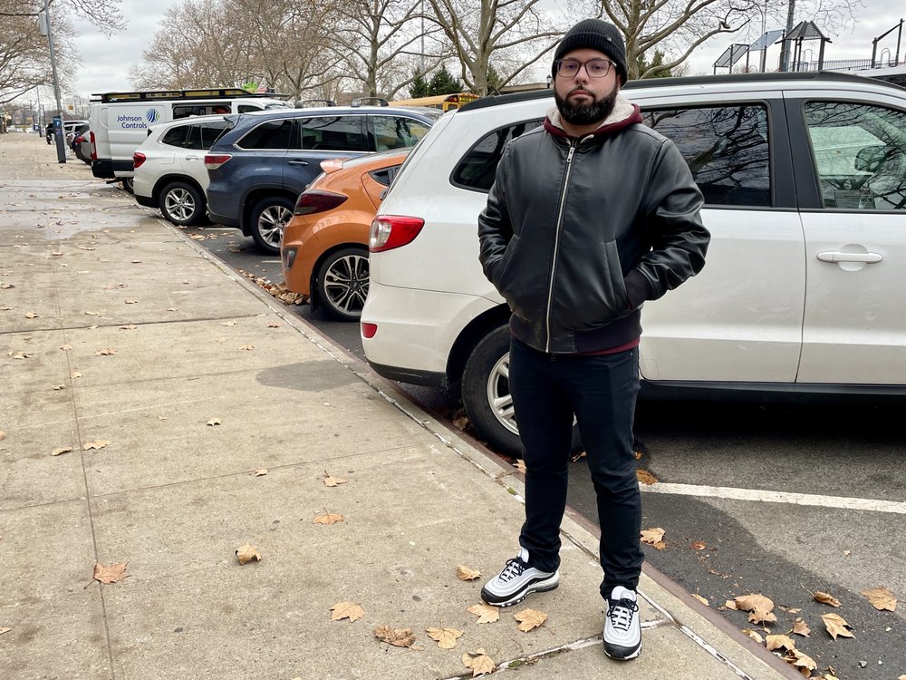 Jonathan Berenguer stands in front of Lehman College in the Bronx, where his car was stolen in September.