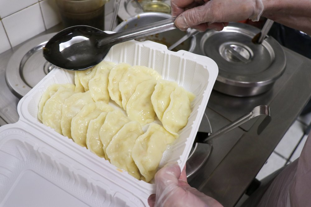 Food in a takeout clamshell container.